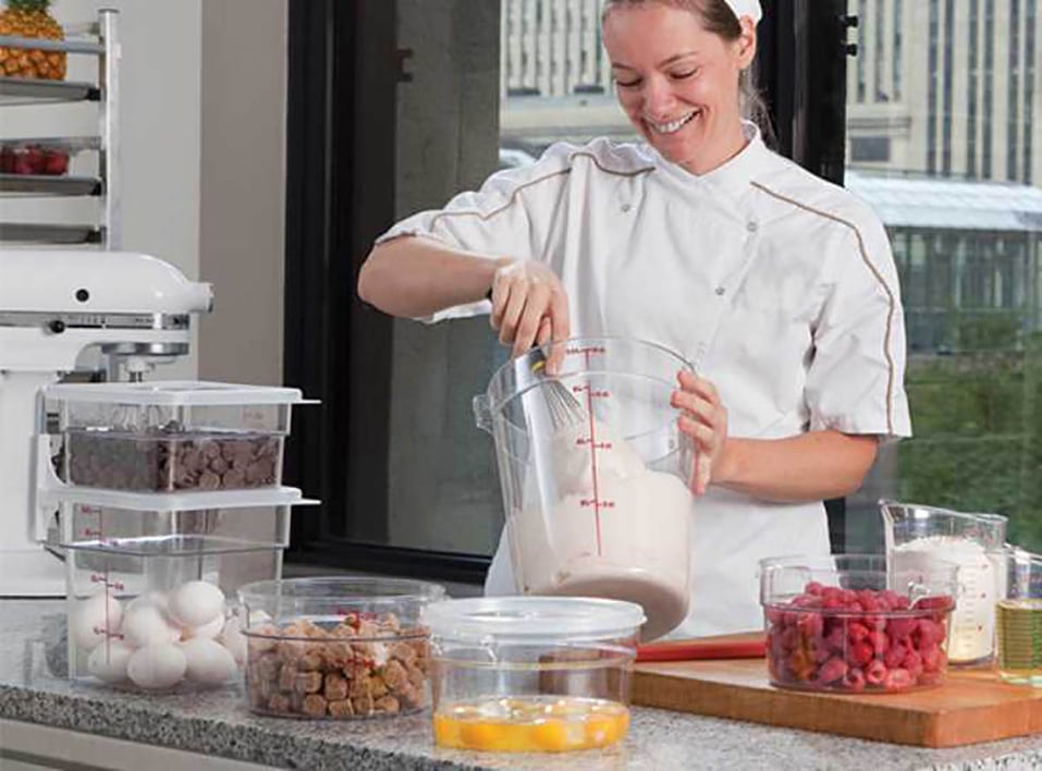 baker using Cambro containers to bake in her kitchen