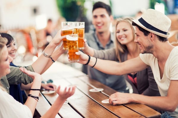 Friends raising a glass at a beer garden