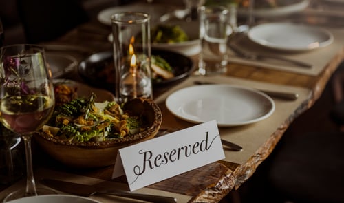 Restaurant table with reserved sign