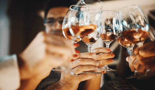 Wine tasting - Group of friends clinking glasses