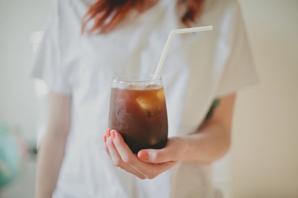 Woman holding cold brew coffee